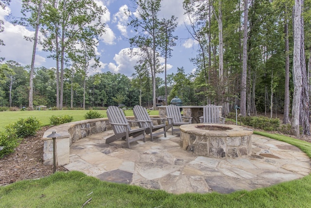 view of patio / terrace featuring an outdoor fire pit