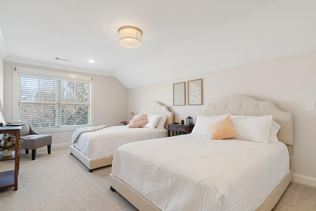 bedroom featuring lofted ceiling and light colored carpet