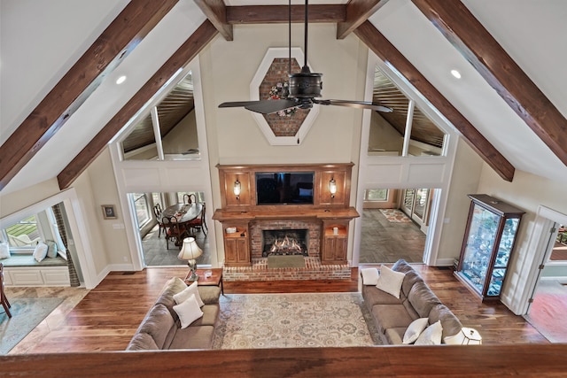 165 Lakeview Dr, Eatonton, GA 31024 - living room featuring a ceiling fan, beam ceiling, wood finished floors, a brick fireplace, and recessed lighting