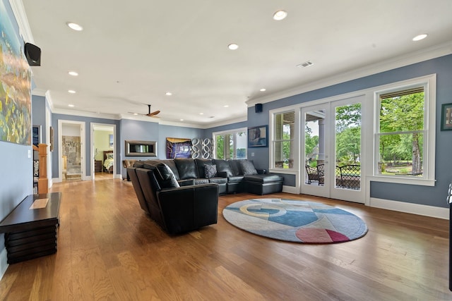 1101 Shoal Creek Ct, Greensboro, GA 30642 - living room featuring crown molding, recessed lighting, visible vents, and french doors