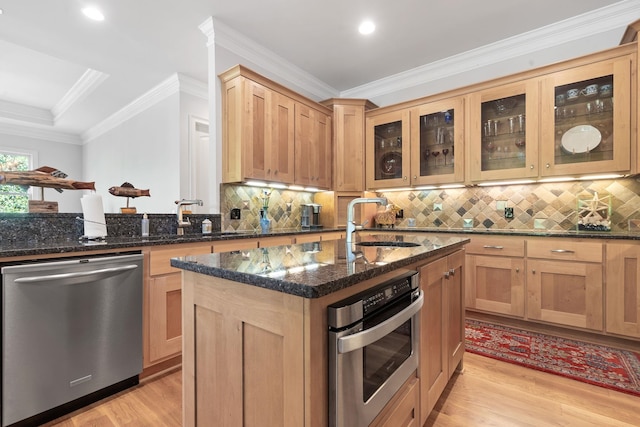 1101 Shoal Creek Ct, Greensboro, GA 30642 - kitchen featuring a sink, appliances with stainless steel finishes, light wood-style floors, and dark stone counters