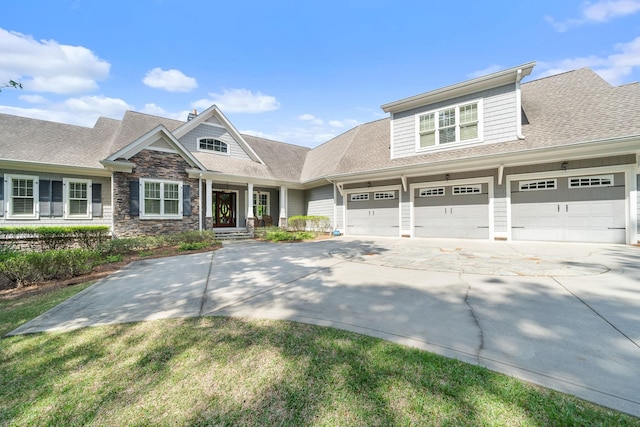 1101 Shoal Creek Ct, Greensboro, GA 30642 - craftsman-style house with roof with shingles, an attached garage, concrete driveway, and stone siding
