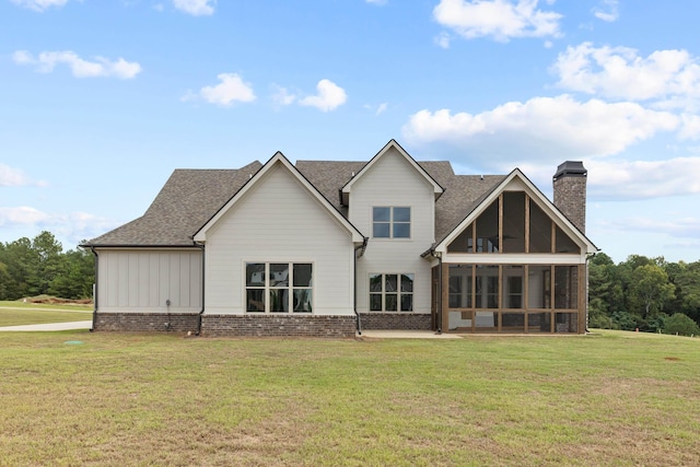 1201 Askew Trl, Greensboro, GA 30642 - back of house with a sunroom, roof with shingles, a yard, and a chimney