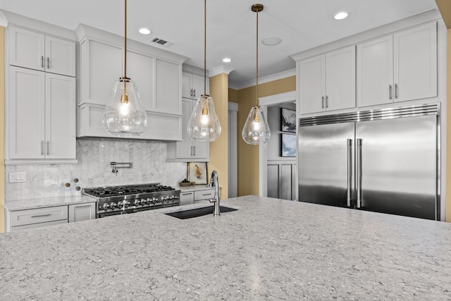 1201 Askew Trl, Greensboro, GA 30642 - kitchen with visible vents, decorative backsplash, stove, built in fridge, and a sink