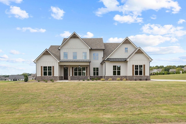 craftsman-style home featuring a front lawn