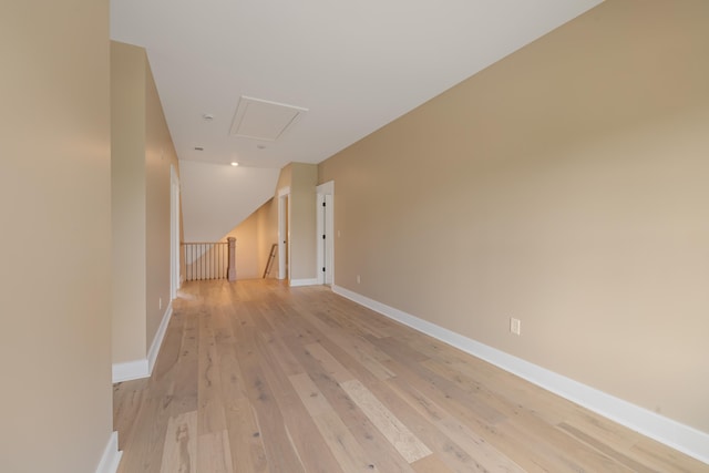 1201 Askew Trl, Greensboro, GA 30642 - hallway with baseboards, an upstairs landing, light wood-style flooring, and attic access