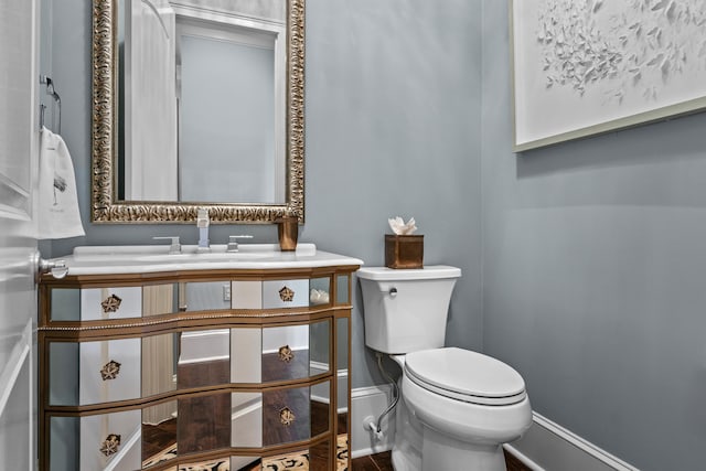 bathroom with vanity and toilet