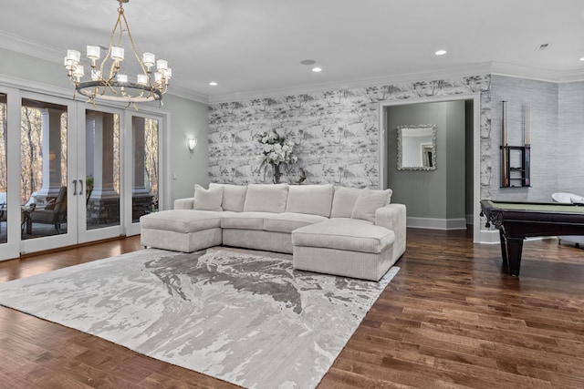 living room with ornamental molding, dark hardwood / wood-style floors, and french doors