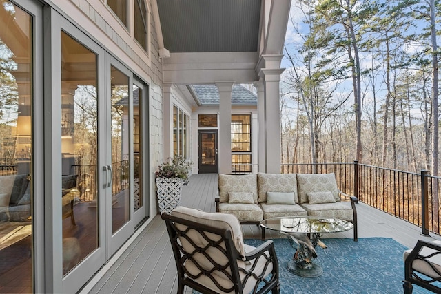 wooden deck featuring french doors