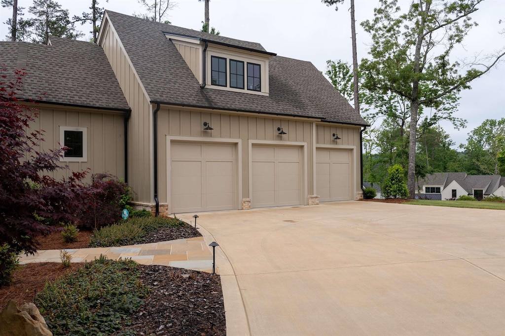 garage with concrete driveway