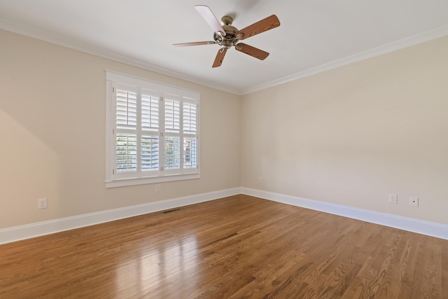 spare room featuring crown molding, hardwood / wood-style floors, and ceiling fan