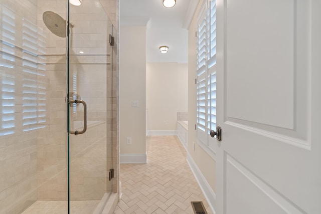 bathroom featuring a shower with shower door