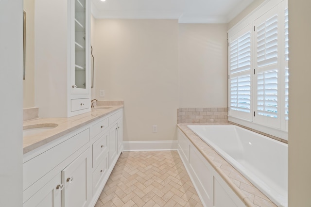 bathroom featuring vanity, a tub, and crown molding