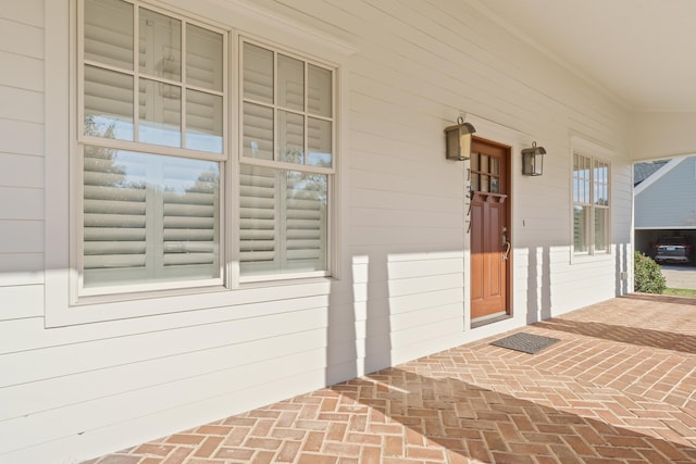 property entrance featuring covered porch