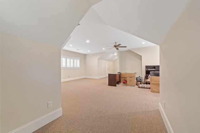 additional living space with ceiling fan, light colored carpet, and lofted ceiling