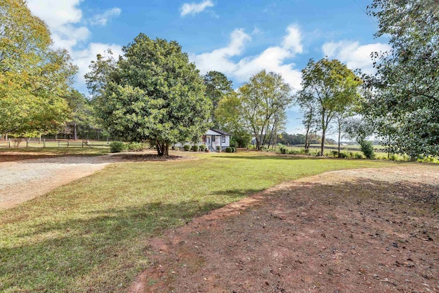 view of yard with a rural view