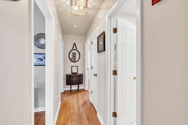 corridor with light wood-type flooring