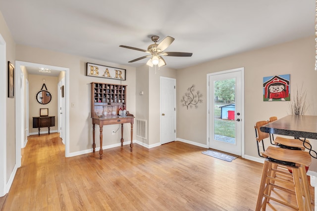 entrance foyer featuring light hardwood / wood-style flooring and ceiling fan