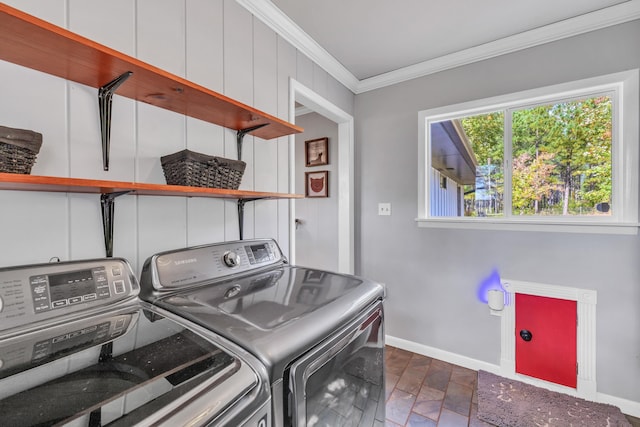 clothes washing area featuring ornamental molding, dark hardwood / wood-style flooring, and washing machine and dryer