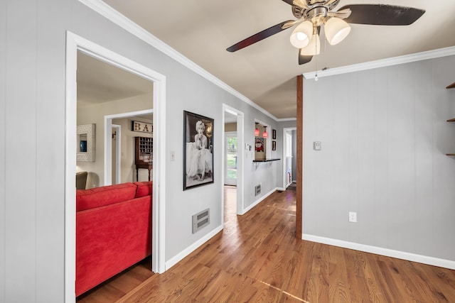 interior space featuring hardwood / wood-style flooring and ornamental molding