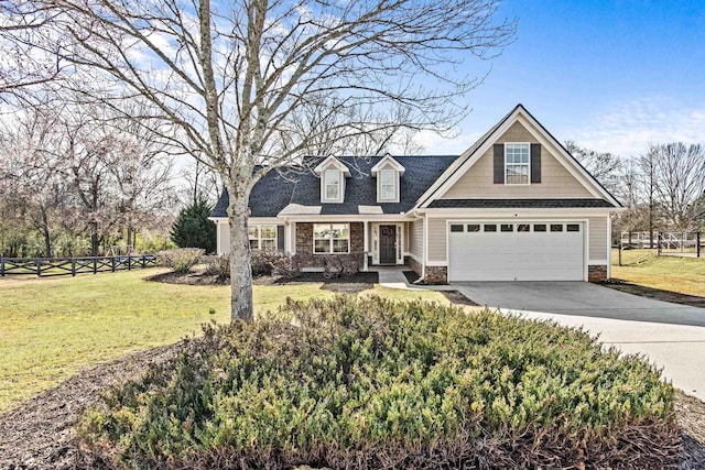 view of front facade with driveway, a front lawn, and fence