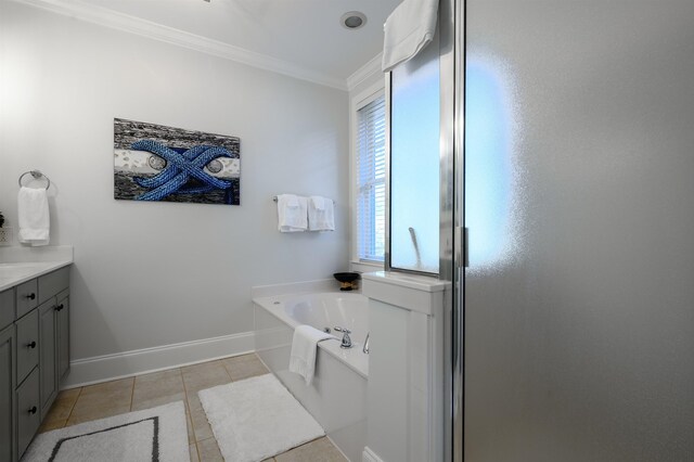 bathroom with vanity, tile patterned floors, ornamental molding, and a bathing tub