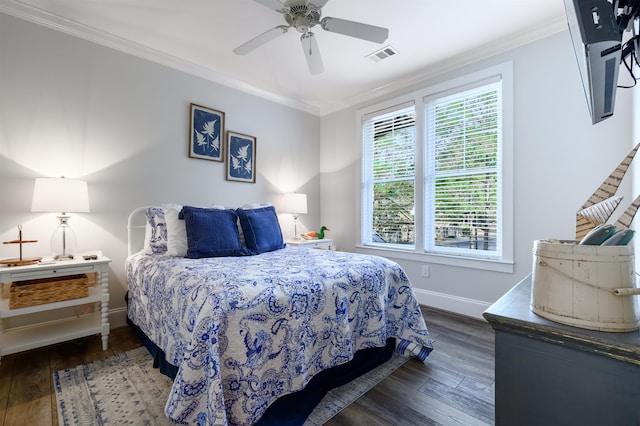 bedroom featuring crown molding, dark hardwood / wood-style floors, and ceiling fan