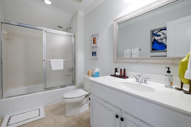 full bathroom with vanity, tile patterned floors, shower / bath combination with glass door, and toilet