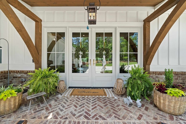 113 Daisy Trl, Milledgeville, GA 31061 - view of exterior entry with board and batten siding and french doors