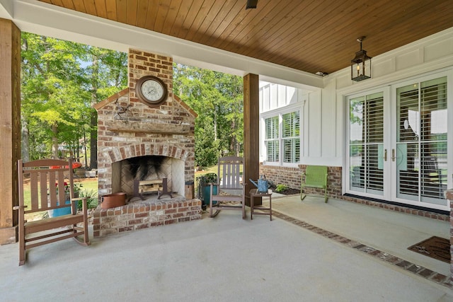 113 Daisy Trl, Milledgeville, GA 31061 - view of patio with an outdoor brick fireplace and french doors
