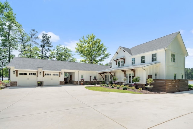 113 Daisy Trl, Milledgeville, GA 31061 - modern farmhouse style home featuring board and batten siding, a shingled roof, concrete driveway, and an attached garage