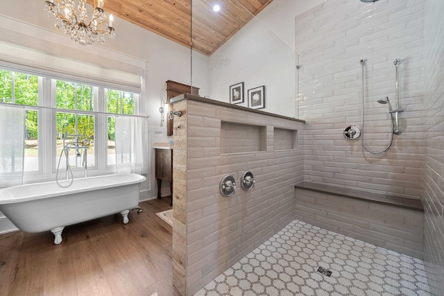 113 Daisy Trl, Milledgeville, GA 31061 - full bathroom with an inviting chandelier, a freestanding tub, a tile shower, wood ceiling, and wood finished floors