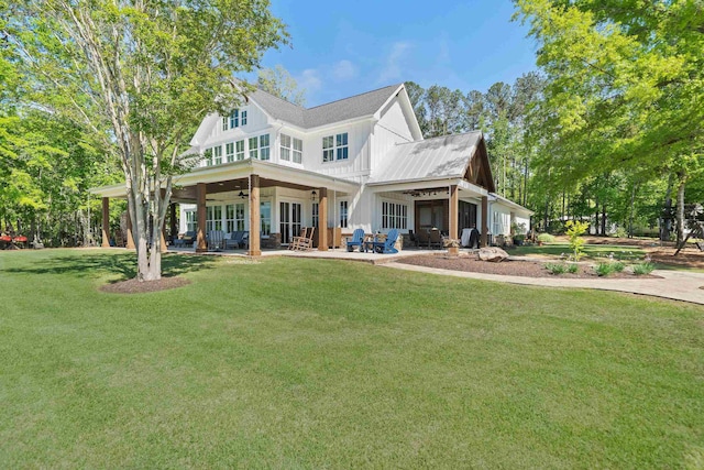 113 Daisy Trl, Milledgeville, GA 31061 - rear view of house featuring a lawn, a ceiling fan, a patio area, and board and batten siding