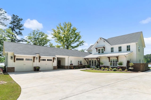 113 Daisy Trl, Milledgeville, GA 31061 - modern inspired farmhouse with a standing seam roof, a garage, a shingled roof, driveway, and board and batten siding