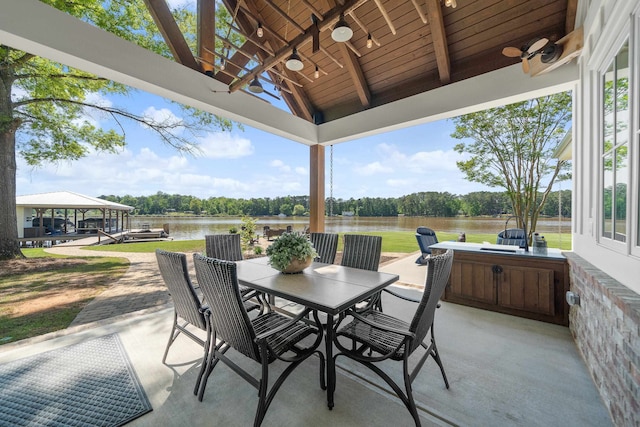 113 Daisy Trl, Milledgeville, GA 31061 - view of patio / terrace featuring outdoor dining space, a dock, ceiling fan, and a water view