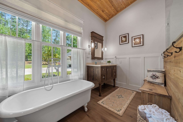 113 Daisy Trl, Milledgeville, GA 31061 - full bath featuring wood ceiling, vaulted ceiling, a freestanding tub, wood finished floors, and wainscoting