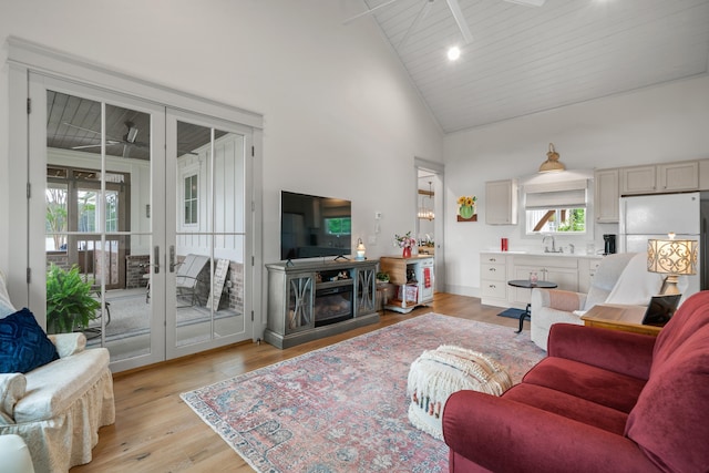113 Daisy Trl, Milledgeville, GA 31061 - living area featuring wooden ceiling, light wood-style floors, a fireplace, high vaulted ceiling, and french doors