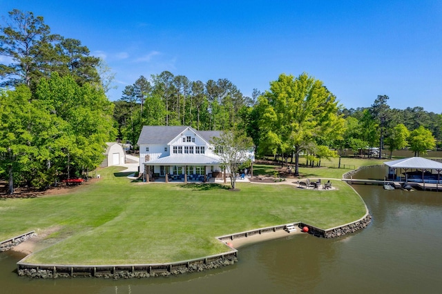 113 Daisy Trl, Milledgeville, GA 31061 - exterior space with a lawn, a storage shed, a water view, and an outbuilding