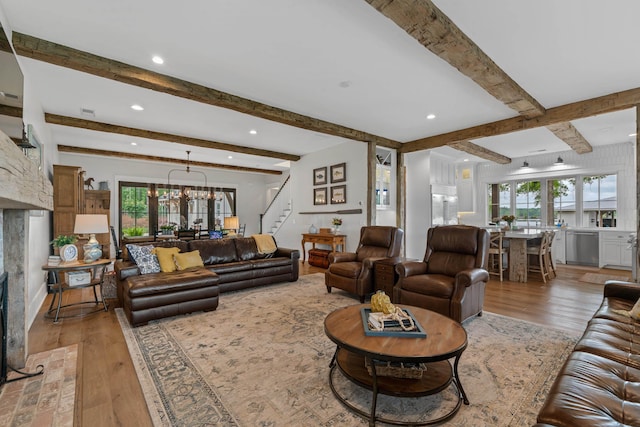 113 Daisy Trl, Milledgeville, GA 31061 - living room featuring a wealth of natural light, light wood-style floors, beamed ceiling, and stairs