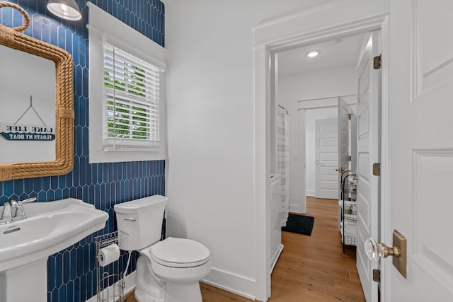 113 Daisy Trl, Milledgeville, GA 31061 - bathroom featuring toilet, a sink, wood finished floors, and baseboards