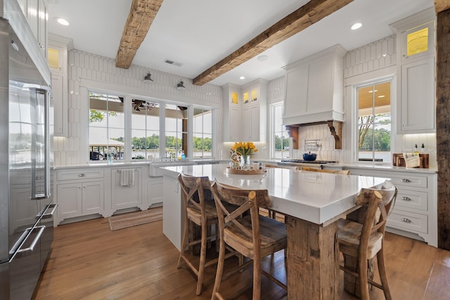 113 Daisy Trl, Milledgeville, GA 31061 - kitchen with white cabinetry, beamed ceiling, decorative backsplash, and built in fridge