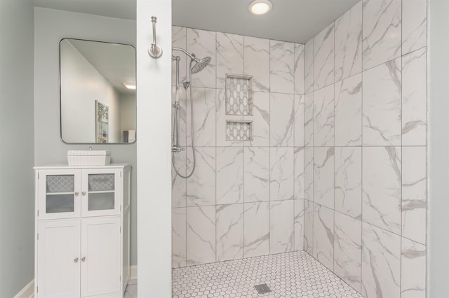 bathroom with a tile shower