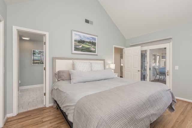 bedroom with light wood-type flooring, visible vents, baseboards, and access to outside