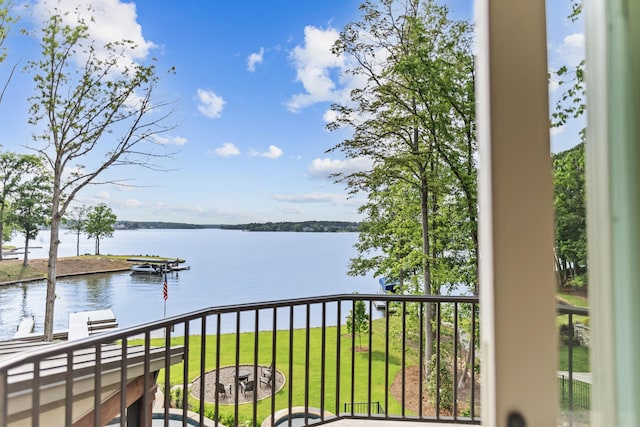 balcony featuring a water view