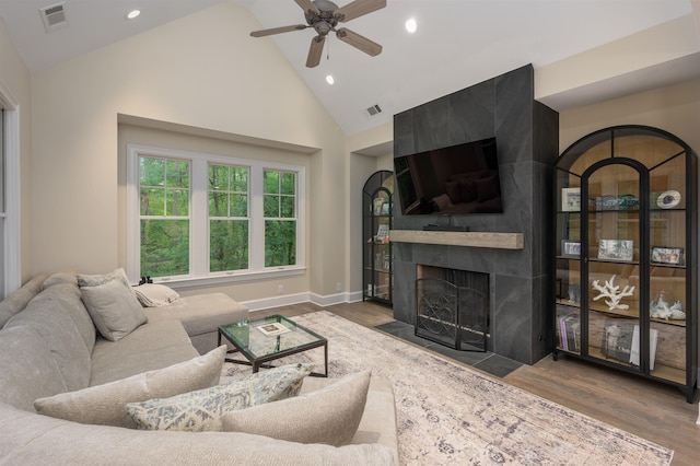 1181 Lockets Trl, Greensboro, GA 30642 - living area with wood finished floors, ceiling fan, high vaulted ceiling, a fireplace, and recessed lighting