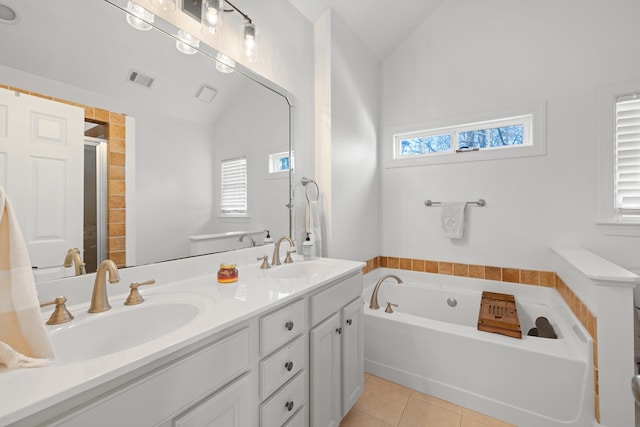 bathroom with lofted ceiling, plus walk in shower, tile patterned flooring, and vanity