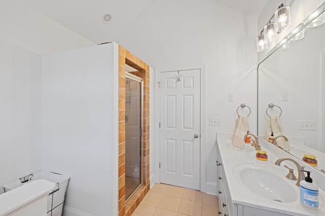 bathroom featuring vanity, tile patterned floors, and a shower with shower door