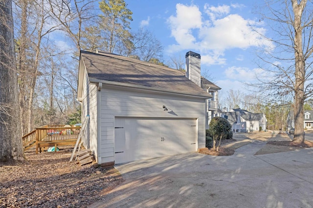 view of home's exterior with a garage and a deck