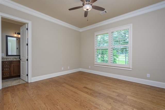1020 Fairway Ridge Cir, Greensboro, GA 30642 - unfurnished bedroom featuring crown molding, light wood-style floors, baseboards, ensuite bathroom, and a ceiling fan