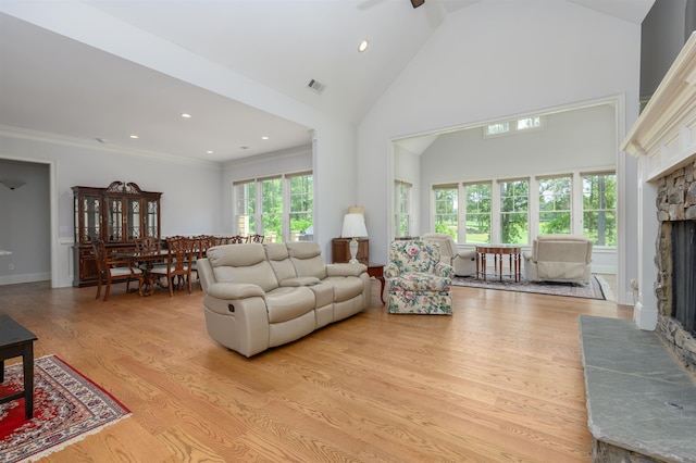 1020 Fairway Ridge Cir, Greensboro, GA 30642 - living area featuring a fireplace, light wood-style floors, high vaulted ceiling, recessed lighting, and ornamental molding